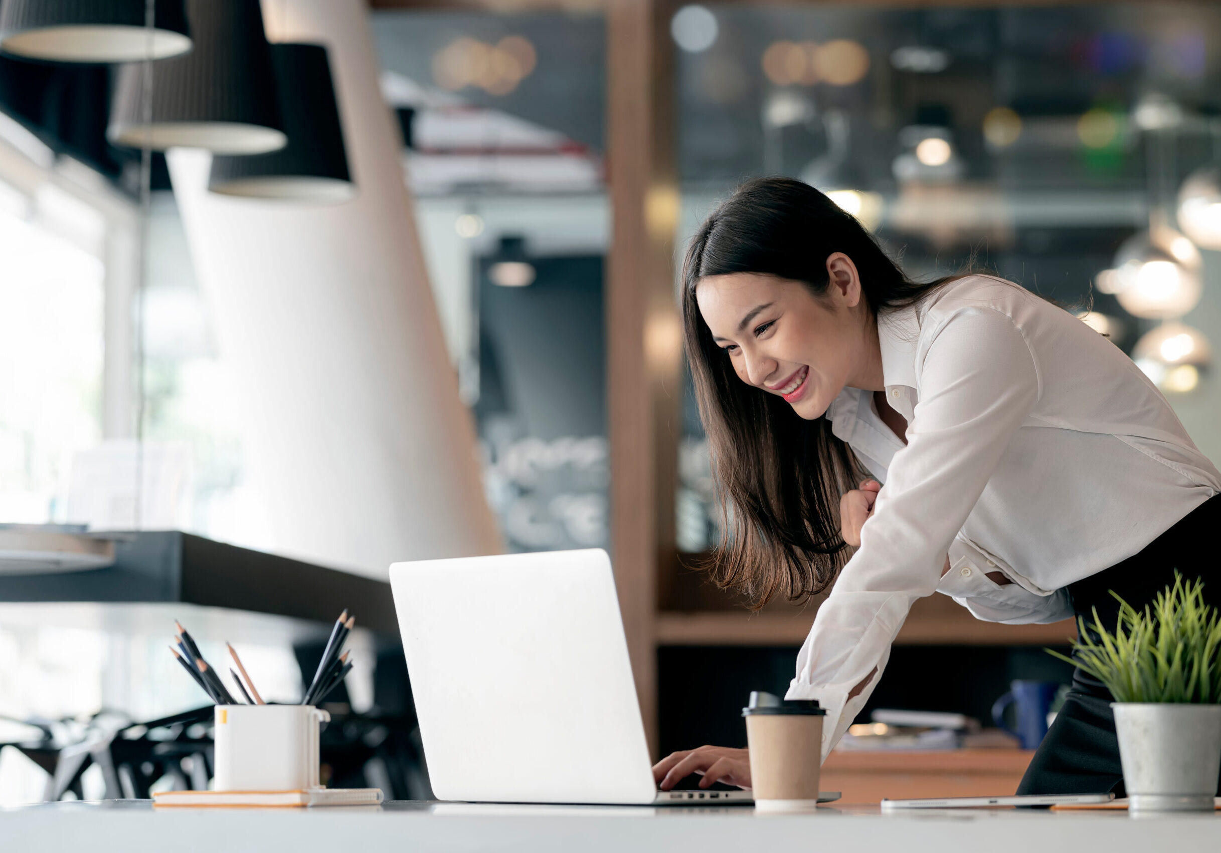 Beautiful,Asian,Businesswoman,Celebrate,While,Using,Laptop,At,Office,And Beautiful,Asian,Businesswoman,Celebrate,While,Using,Laptop,At,Office,And